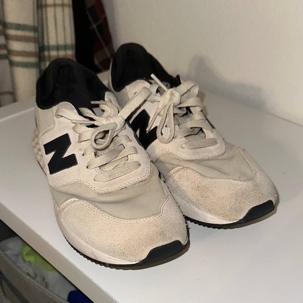 New Balance women’s black and Cream Sneakers